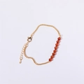 Adjustable gold chain bracelet featuring eight orange-red faceted crystal beads - January - Garnet Red