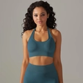 Detail of teal seamless knitted halter sports bra and high-waisted yoga pants set - Black Frame Blue Lens Retro