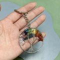 Detailed close-up of a Tree of Life keychain with colorful natural seven chakra stones - Tree of Life Keychain / Rainbow