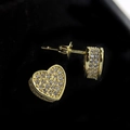 Macro shot of 18k gold plated heart stud earrings with shimmering pave set stones - Sparkling Heart Stud Earrings [Yellow Gold Plated]