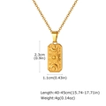 Detailed view of vintage gold rectangle pendant necklace with sun and moon celestial motifs - Star Moon Tag / Gold