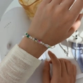 Rainbow cubic zirconia tennis bracelet in silver finish worn on female wrist - Double Row Rainbow/Multicolor