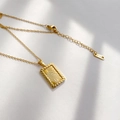 Macro detail of sunburst textured rectangle pendant with K18 gold hallmark stamp - Square Sunburst Style