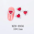 Macro view of 10x11mm heart-shaped red nail gems with silver alloy frames - Silver Base Ruby Red Heart Style (8956)