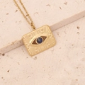 Detail of a vintage gold rectangular evil eye pendant with a blue center stone - Blue Gemstone Rectangular Style (4#)