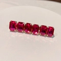 Detailed view of pink rectangular crystal hair clip on elegant gold metal base - Square Rose Red