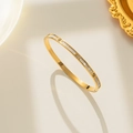 Rose gold titanium bangle with white shell inlay and sparkling zircon accents for women - Gold