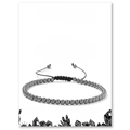 Close-up of a 4mm hematite beaded bracelet on a display card with descriptive text - Hematite Bracelet