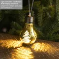 Golden LED Christmas bulb ornament with white tree pattern and warm festive glow - Golden Christmas Tree