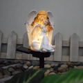 Solar powered angel statue garden light with warm white glow for outdoor patio decor - Parent-Child Angel