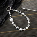 Silver beaded phone lanyard with pearls and star charms on a dark textured background - Irregular Five-pointed Star Style (K3019) / Silver