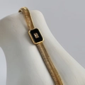 Detailed close-up of 18k gold plated snake chain bracelet with black enamel square pendant - 18+3cm / Black Bracelet