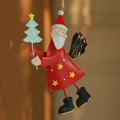 Handcrafted red metal Santa Claus ornament holding a green tree with rustic hanging rope - Angel Santa Claus