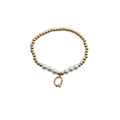 Detail of gold beaded bracelet with white pearls and a colorful zircon letter Q charm - Letter Q