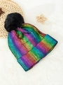 Rainbow metallic knit beanie with black faux fur pom pom on white faux fur backdrop - One Size / Colorful