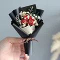 Detailed view of mini dried flower bouquet with red roses and baby's breath - Red Rose (Black Wrapping)