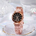 Detail of rose gold watch featuring black dial with diamond markers and metal strap - Rose Gold with Black Dial