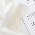 Close-up of a white marble pattern acetate comb on soft white silk fabric - 15.1*6.1cm / Mermaid Color