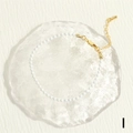 Close-up of white beaded bracelet with gold-plated lobster clasp and adjustable chain - White