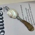 Elegant butter knife featuring a natural pearl conch shell handle with metal blade - Moonlight Shell Butter Knife
