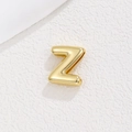 Close-up of gold 10mm DIY letter Z charm for bracelet band on white textured background - Letter Z / Gold