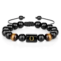 Detail of 10mm black agate beaded bracelet with tiger eye stones and golden letter O charm - Letter O