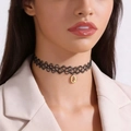 Close-up of a handmade black fishline choker necklace with a gold Q letter pendant. - Letter A Style