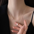 Elegant stainless steel snake chain necklace with freshwater pearl pendant worn by model - Titanium Steel Freshwater Pearl Pendant Necklace