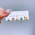 Detail shot of cute cartoon animal stud earring set with bear and carousel charms - Amusement Park Style (0908)