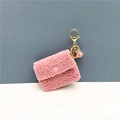 Detail of pink sherpa mini coin purse with gold clasp and elegant tassel charm - Single Piece / Pink