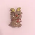 Cute brown glitter reindeer resin charm with golden antlers for Christmas DIY crafts - Glitter Reindeer Holding a Cup
