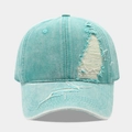 Close-up of distressed light blue denim baseball cap with vintage ripped details - Adjustable / Lake Blue