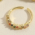 Macro detail of golden open ring with multi-color zircons and polished finish - Adjustable Open / Square Colorful Zirconia