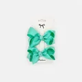 Detail view of mint green grosgrain ribbon bow clips on a white display card - 2 Pcs/Set / Green
