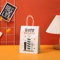 Detail of white Happy Birthday gift bag with blue candle print in warm party setup - 605-1 (White Blue Candle)