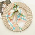 Detail view of colorful plaid scrunchie with long ribbons on a decorative beige tray - Multi-color Plaid