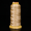 Champagne gold beaded string on yellow spool for DIY jewelry making and weaving - Beige