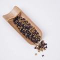 Mix of artificial black, amber, and red brown seeds in a bamboo scoop prop - Mixed Small Grapes (500g)
