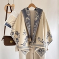 Beige cashmere-like scarf with blue flower pattern and fringe, styled on an overcoat - Fresh Floral-Blue