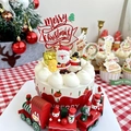 Close-up of Merry Christmas acrylic topper on red cupcake with festive holiday decor - Christmas Tree Red Merry Christmas