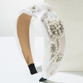 Detail of white mesh headband featuring elegant pearl clusters and crystal rhinestones - White