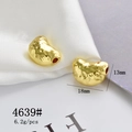 Macro shot of 18x13mm gold bean-shaped pendant with textured surface for DIY jewelry - Gold Bean Shape Jewelry Finding (4639#)