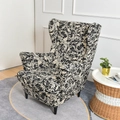 Single wingback armchair cover with black and white graphic pattern in a home setting - Black Phoenix Tail