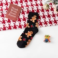 Calcetines negros festivos con patrones de hombre de jengibre y acebo de Navidad clásicos - Talla única / Negro
