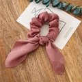 Pink satin hair scrunchie with streamers and bow on a dark wood decorative background - Dusty Pink