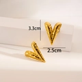 Detail view of 18K gold plated hammered heart earrings with size dimensions 3.3cm and 2.5cm - Water Ripple Heart / Gold