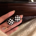 Handheld view of vintage round stud earrings with black and white checkered patterns - Black and White Checkerboard Circle (38# Silver Needle)