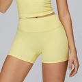 Completo yoga da donna con pantaloncini a vita alta e crop top giallo chiaro - giallo oca