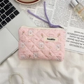 Detailed view of floral quilted cotton organizer bag with bunny print and purple handles - Skateboard Rabbit