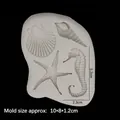 White silicone mold featuring detailed shell, seahorse, and starfish for DIY fondant crafts - Gray